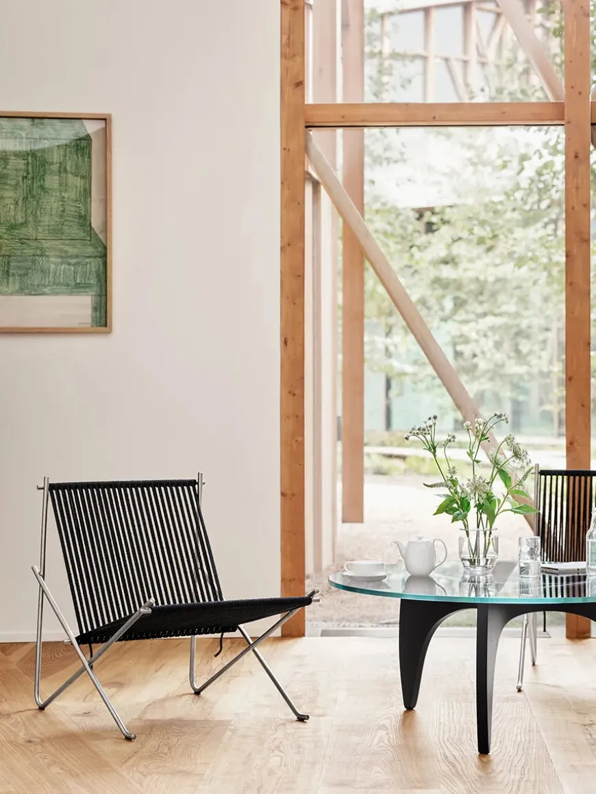 PK4 Loungestol i sort, stålstel af Poul Kjærholm